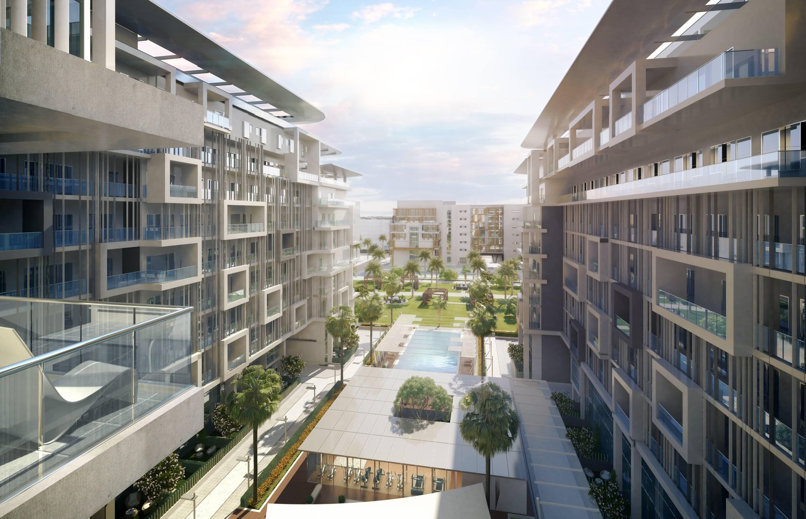 Masdar Oasis Residences showcasing outdoor lifestyle amenities including swimming pools, children’s play areas, and shaded leisure spaces in Abu Dhabi